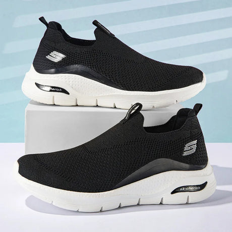TigleX FreeStep Schuh in Schwarz mit weißer Sohle – ergonomischer Slip-On mit atmungsaktivem Obermaterial und starker Fußgewölbeunterstützung