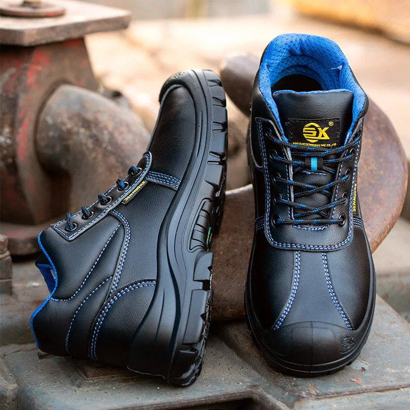 tgx-w38-unisex-sicherheitsstiefel-nahaufnahme-vorne paar nicht getragen liegt auf dem boden